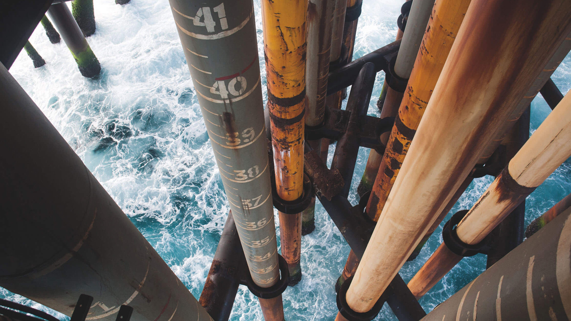 Oil pipes protruding from the ocean