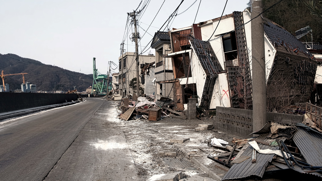 picture of damage to a street after a natural disaster