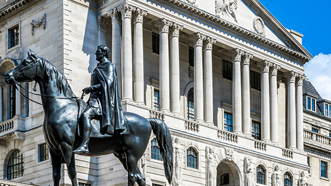 Bank of England building in London, with Duke of Wellington statue in view