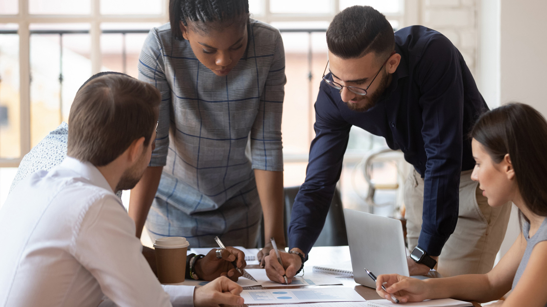 Business professionals working together around a conference table at the office