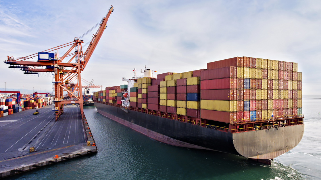 cargo ship next to crane