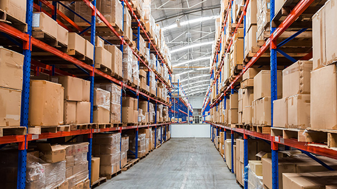 Warehouse shelves stocked with cardboard boxes