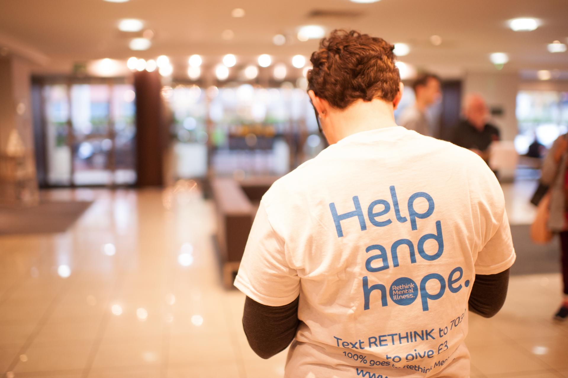 Man with t-shirt saying 'help and hope'