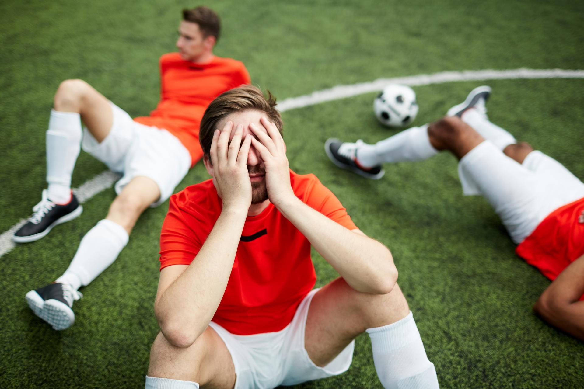 exhausted football players