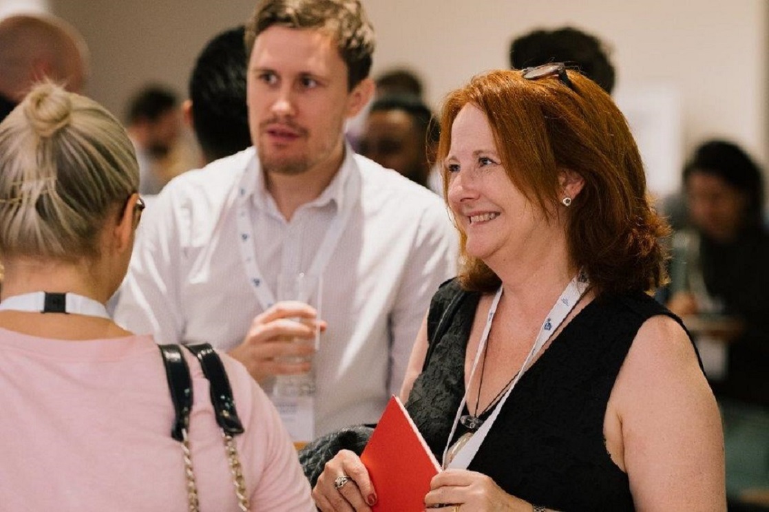 woman in audience smiling