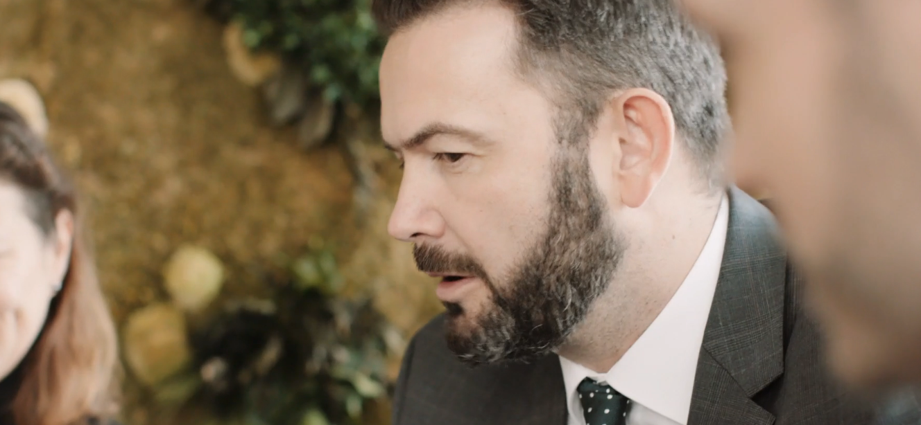 Person speaking to colleagues