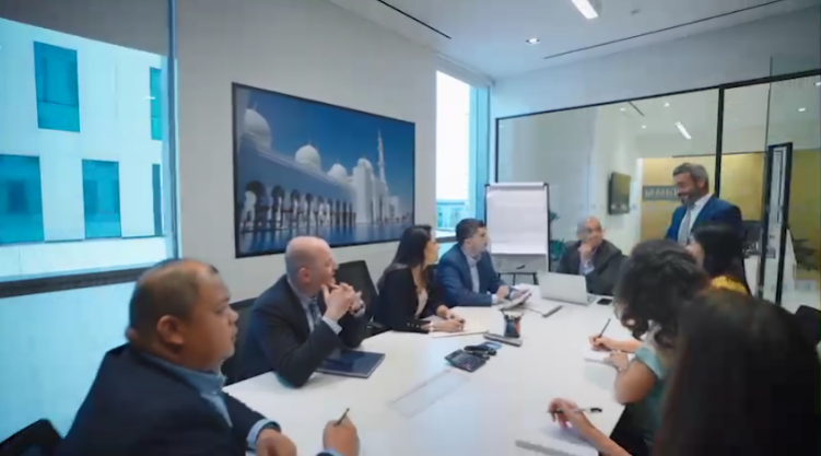 Team of people talking around a table