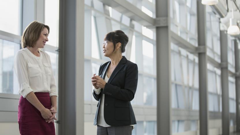 two women talking in an office