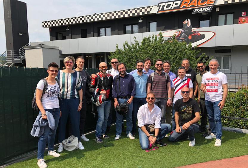 Group of employees pose for a photo at Top Race Park during Italy Team Day