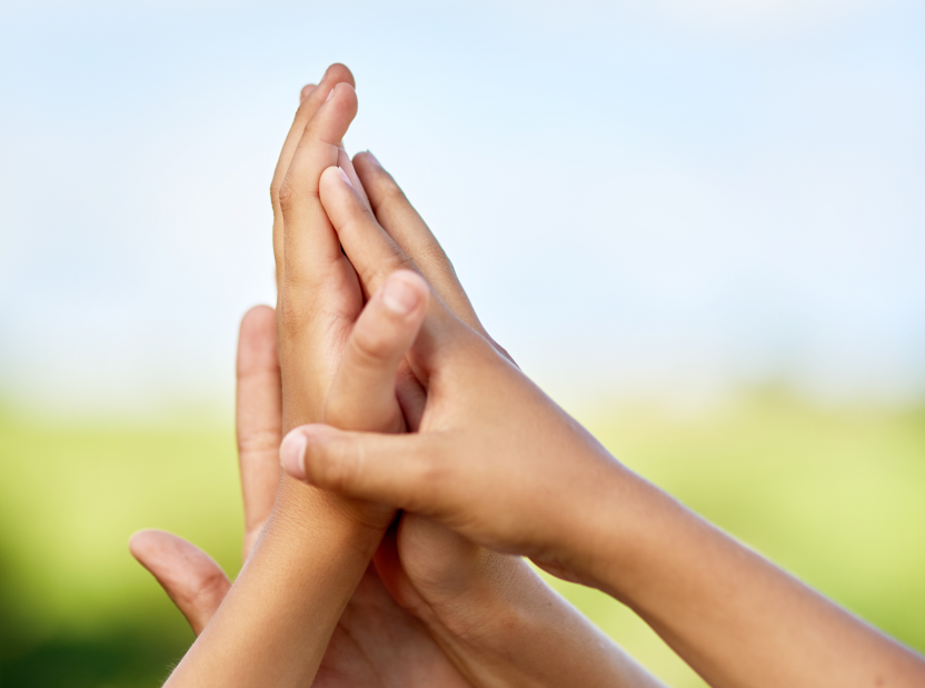 Children's hands clasped together