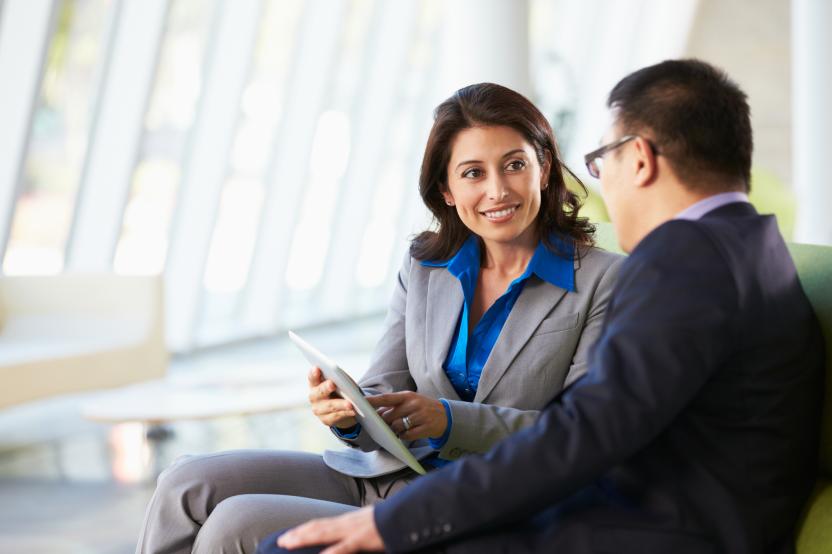 Business man and business woman talking