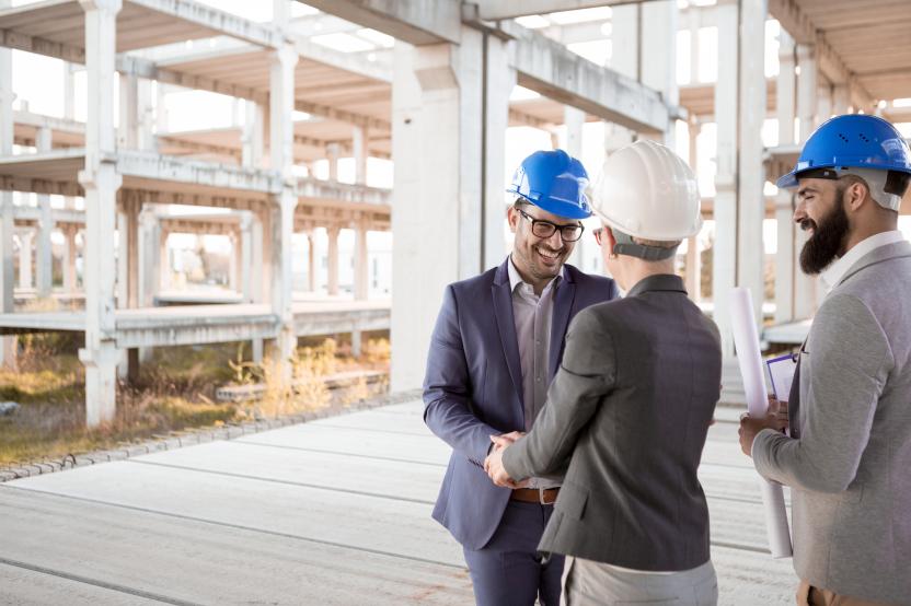 People in hardhats at a building site