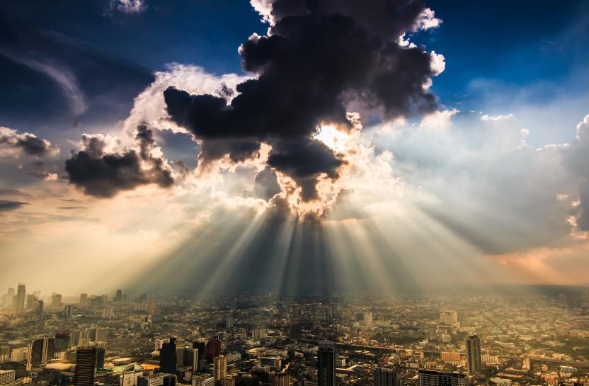 Sun rays through cloud. Climate Resilient Construction.